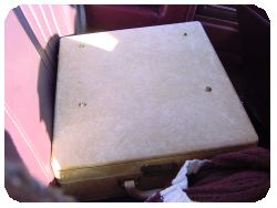 Typewriter case in backseat